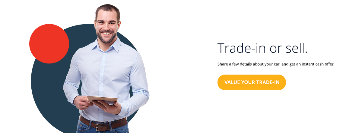 Man holds tablet, value your trade-in